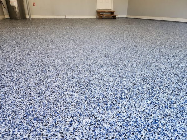 Close-up texture detail of cobalt blue flake epoxy floor coating, Mooresville NC