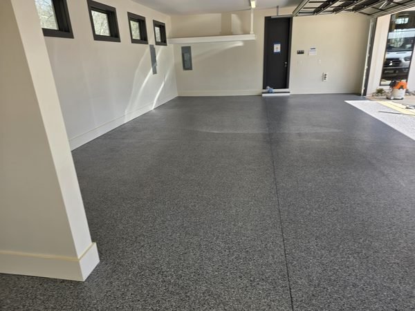 Spacious 3-car garage with side-wall windows and charcoal flake epoxy floor, Lake Norman NC