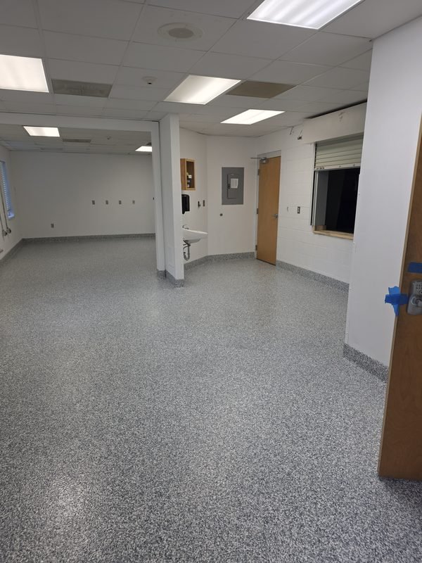 Residential garage with warm tan and grey flake epoxy floor coating, after installation, Mooresville NC