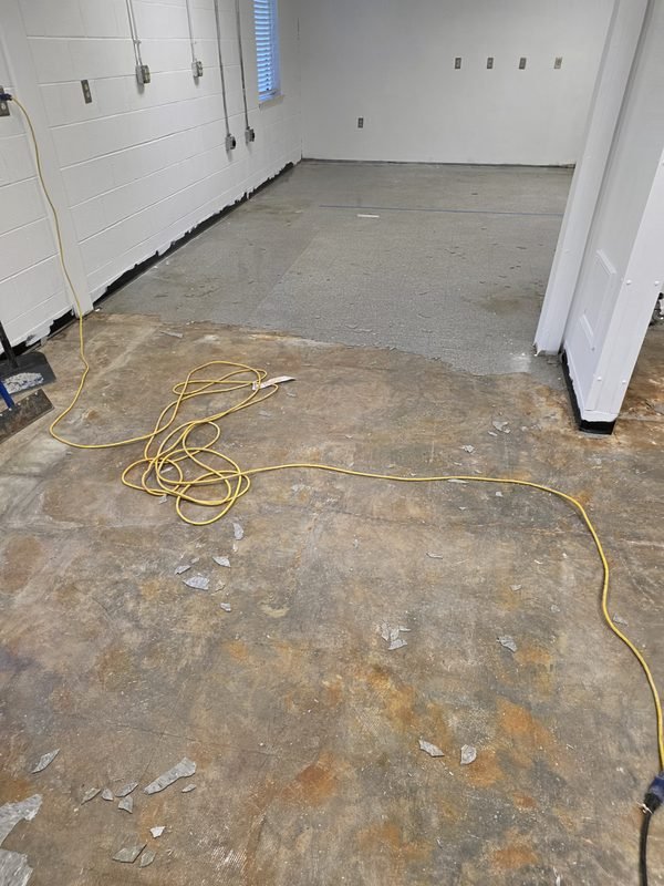Bare concrete garage floor before warm tan and grey flake epoxy installation, Mooresville NC