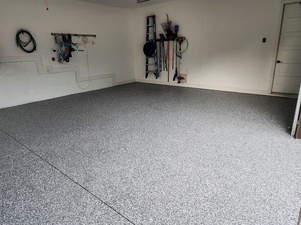 Two-car residential garage with workbench and grey flake epoxy floor, Mooresville NC