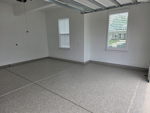 Two-car residential garage with multi-tone flake epoxy floor, view one, Mooresville NC