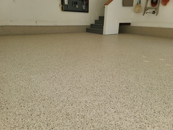 Residential garage with light flake epoxy coating and finished walls, Mooresville NC