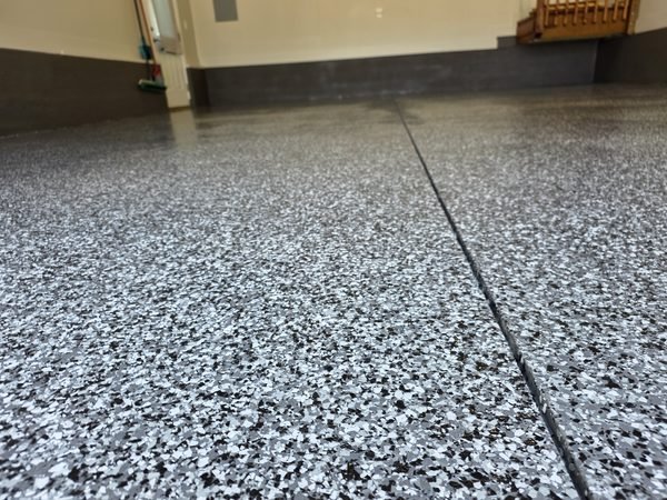 Residential garage with even-tone flake epoxy coating and clean transitions, Mooresville NC