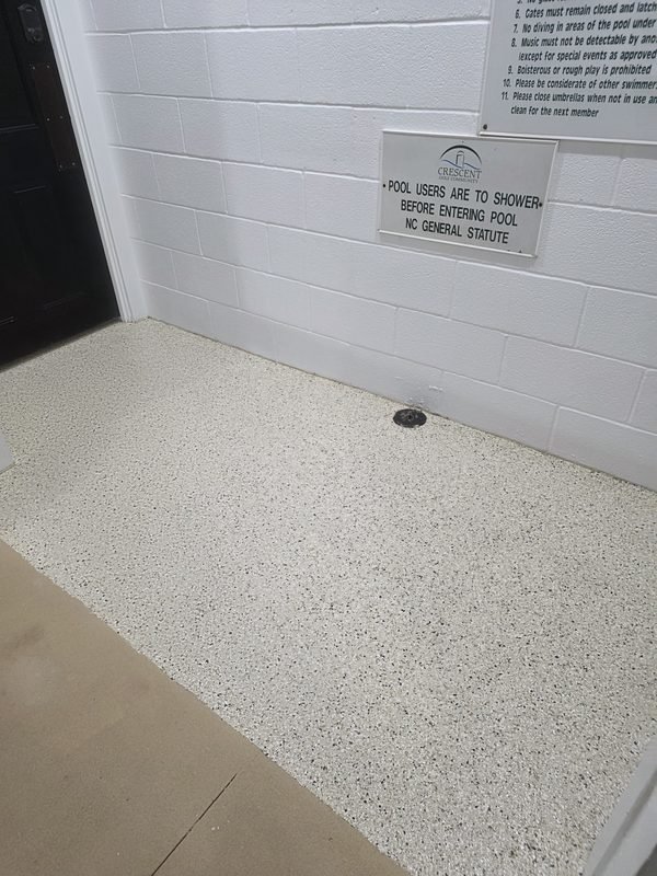 Residential garage with grey flake epoxy floor and finished interior walls, Mooresville NC
