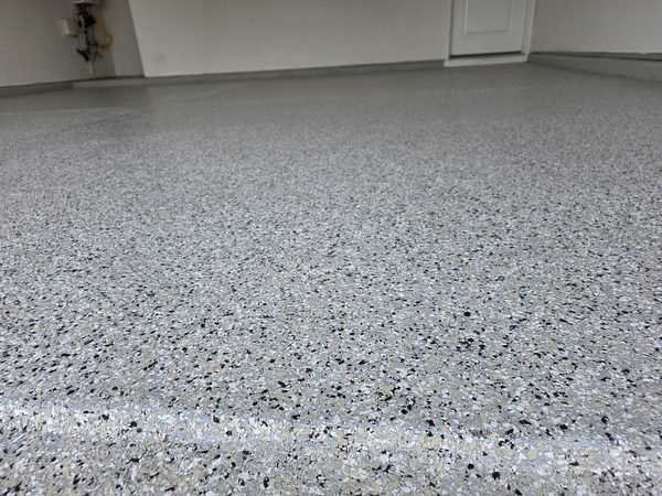 Two-car residential garage with smooth flake epoxy coating and clean walls, Mooresville NC